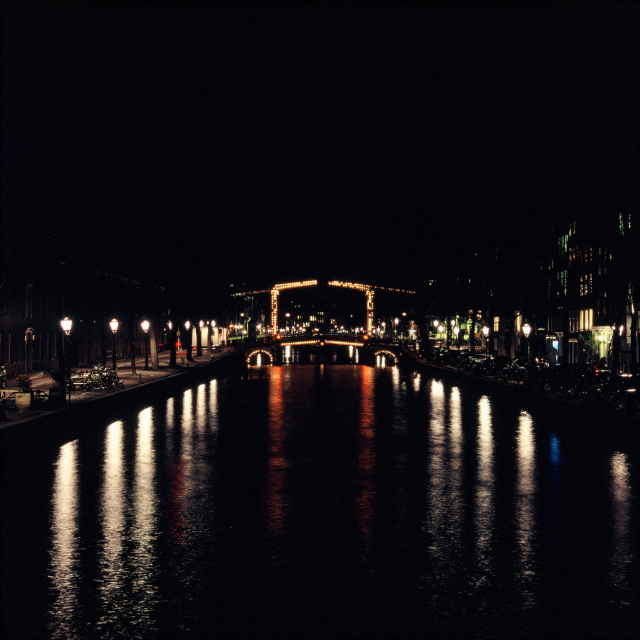 Long exposure night shot of Amsterdam cannal and bridge
